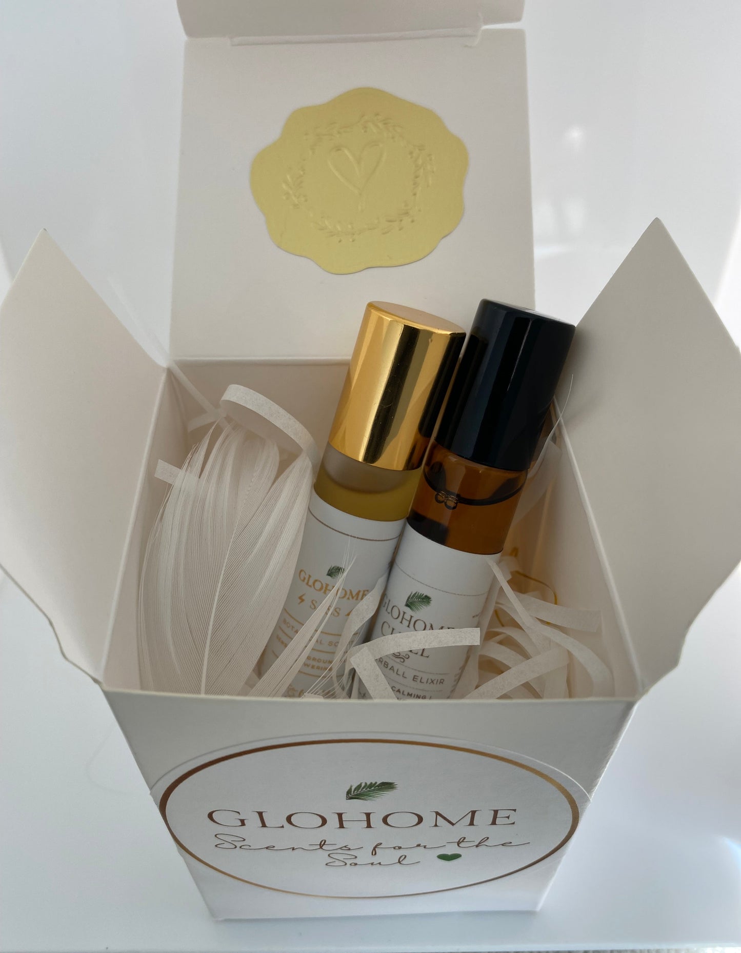 Glohome skincare products in a box with a white background